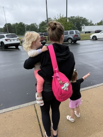 Twin mama walking with her two daughters